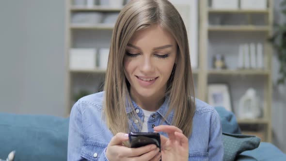 Young Girl Busy Using Smartphone Applications