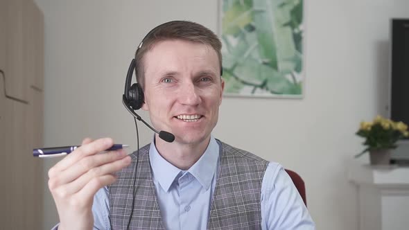 Young Businessman Communicates By Video Link