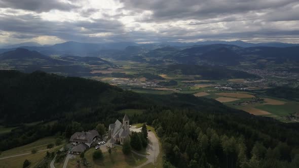 Flight Around Ancient Church on a Mountain. AERIAL View of Magdalensberg, Carinthia, Austria