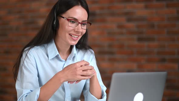 Satisfied Happy Caucasian Businesswoman with Glasses and Headset Support Employee Online Consultant