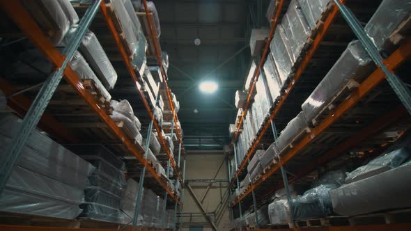 Shelves with Goods in Cardboard Boxes and Packages Full of in Retail Warehouse
