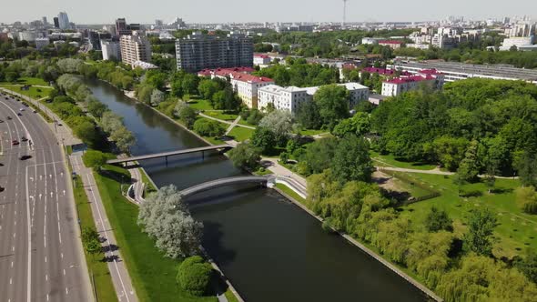 Drone Flies Over City River