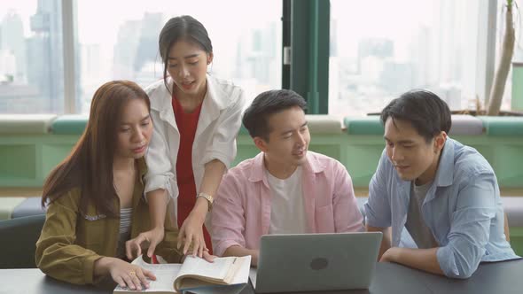 Group of young college friends studying together for their semester exams, discuss topics
