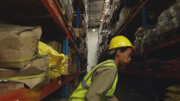 Young female male worker in a warehouse