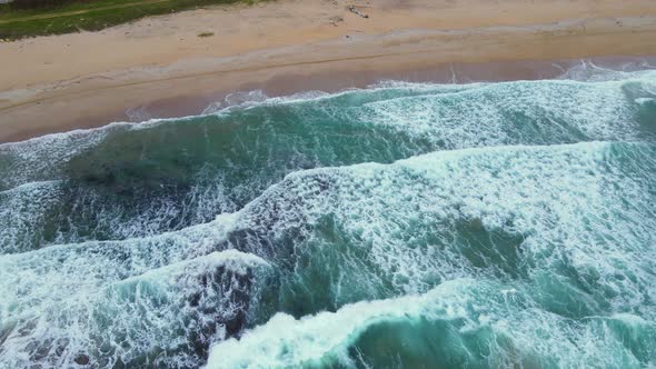 High and powerful waves coming fast to the beach, waves in winter day