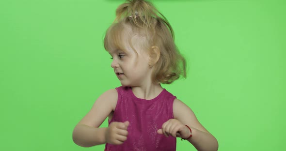 Girl in Purple Dress Tells Something. Happy Four Years Old Child. Chroma Key