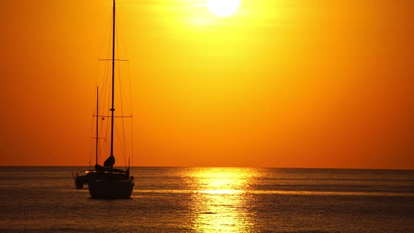 Sail boat in tropical sea at beautiful sunset or sunrise sky