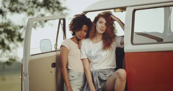 Two Beautiful Young Women Posing for a Photo