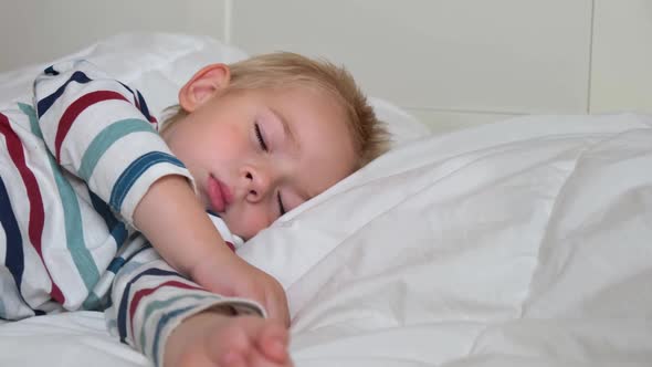 Sleeping Child in Bed