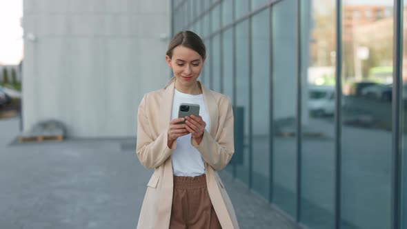 Businesswoman Working with Modern Smartphone Outdoors