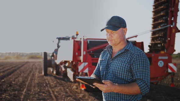 Farmer Using Digital Tablet