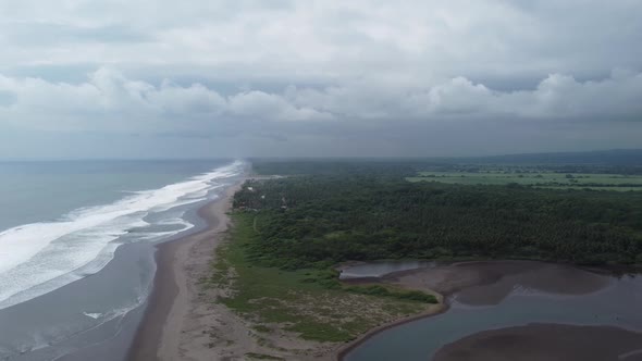 Side panning above wetlands ocean river delta next to mangrove forest