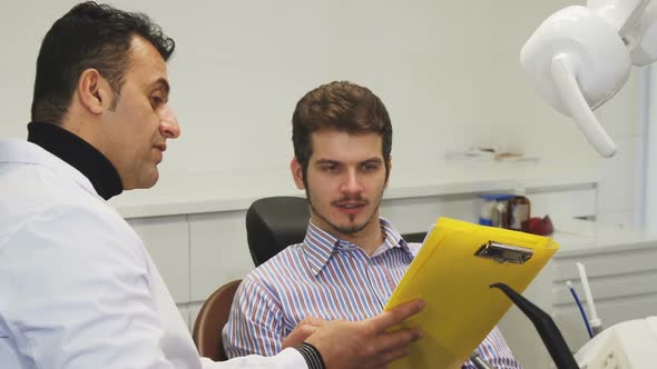 Young Man Having Medical Appointment with His Dentist