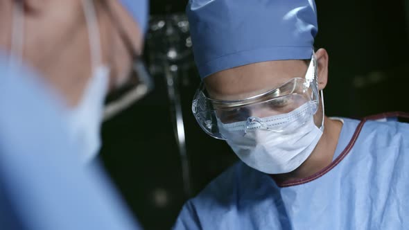 Surgeons Working in Operating Theatre