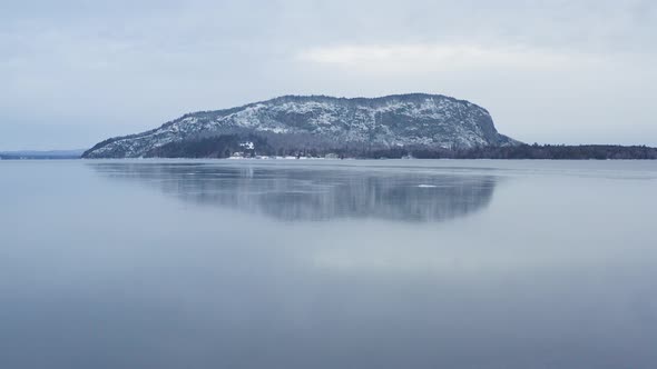 Ice formed on surface of Moosehead Lake with Mount Kineo Aerial