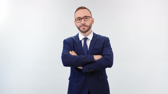 Portrait of Smiling Male Boss Posing with Crossed Hands