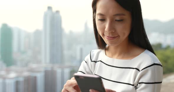 Woman Use of Mobile Phone in City