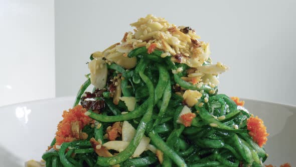 Rolling Zucchini Noodles Dish. Restaurant Food Side View Closeup