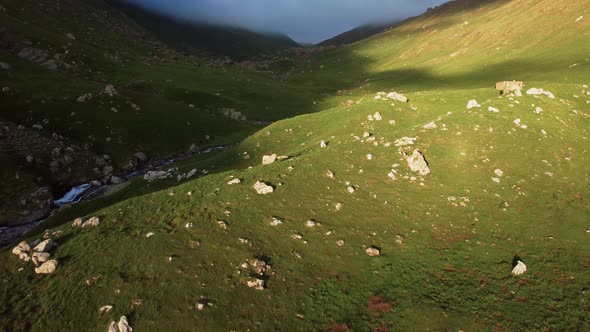 Aerial view of a cloudy valley in the mountains during spring in the pyrenees