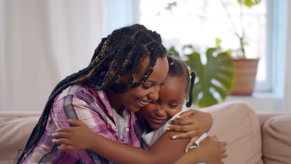 Happy Loving African Mother Posing for Portrait with Preteen Daughter