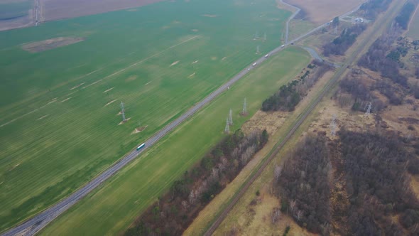 Aerial view of road with moving cars