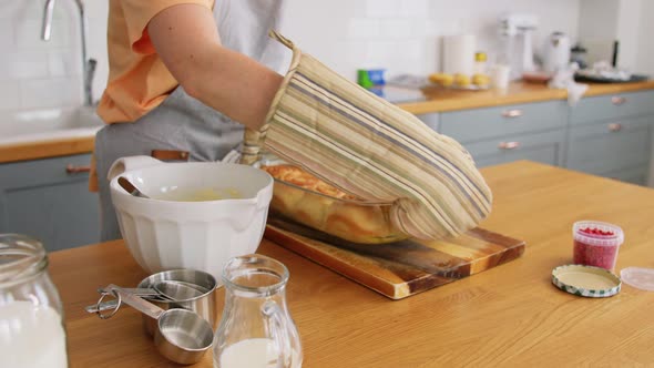 Woman Cooking Food and Baking on Kitchen at Home