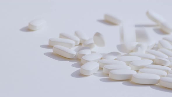 Pile of Pill on White Table