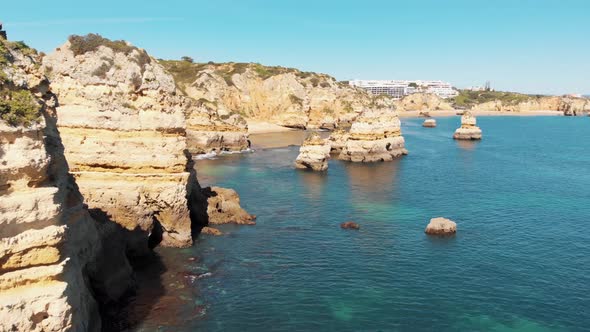 Algarve coast Seaview with golden eroded cliffs next to Atlantic sea