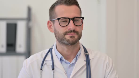 Portrait of Male Doctor Showing No Sign with Finger