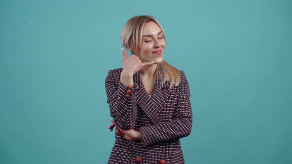 The Young Woman with the Golden Hair Points to the Front with Her Index Finger Then Points with Her