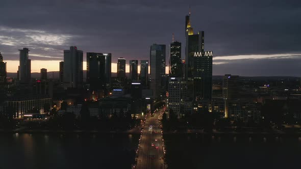 Wide Establishing Shot of Frankfurt Am Main, Germany Skyline at Night Over Main River and