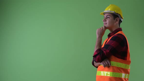 Profile View of Happy Young Multi Ethnic Man Construction Worker Thinking