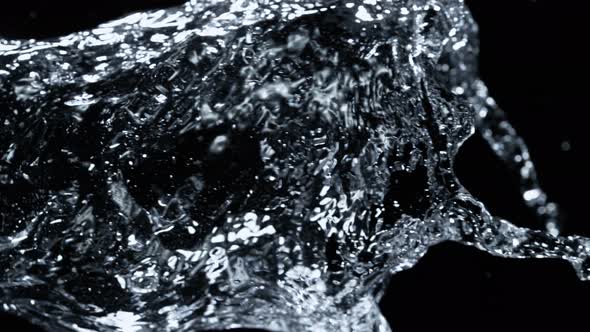 Super Slow Motion Detail Shot of Water Stream Isolated on Black Background at 1000Fps