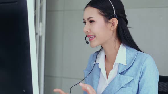 Customer Support Agent or Call Center with Headset Talking to Customer on Phone