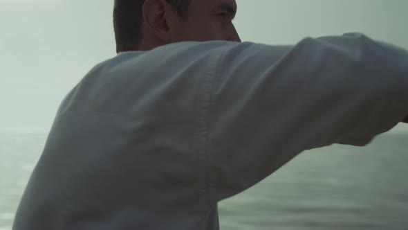 Man Exercising Martial Arts at Sunset Closeup