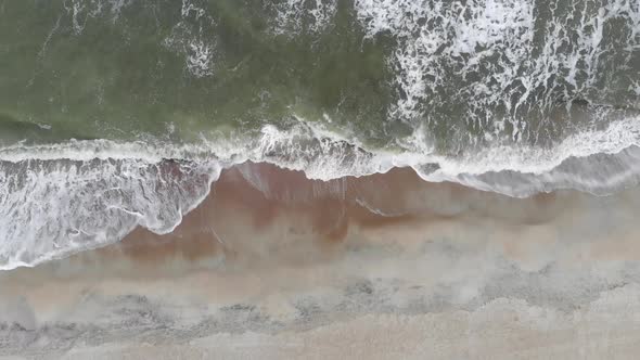ocean waves on beach sand shore line coast earth textures environment tybee island georgia aerial dr