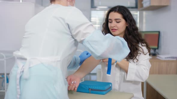 Female Patient Speaking with Nurse before Drawing Blood