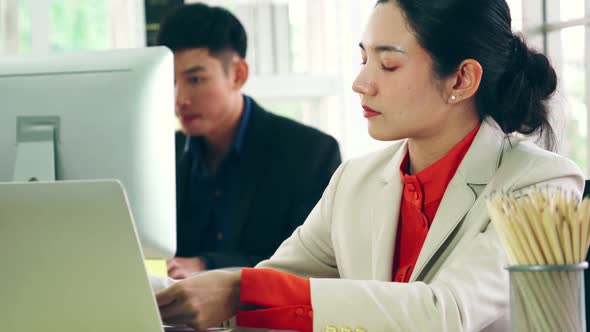 Business People Working at Table in Modern Office