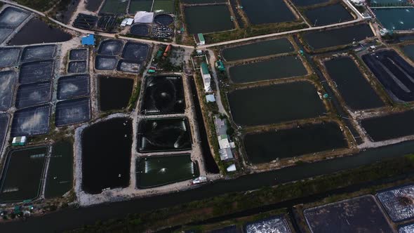 Aerial panorama, industrial Vietnamese salt mine farm fields along ocean coast