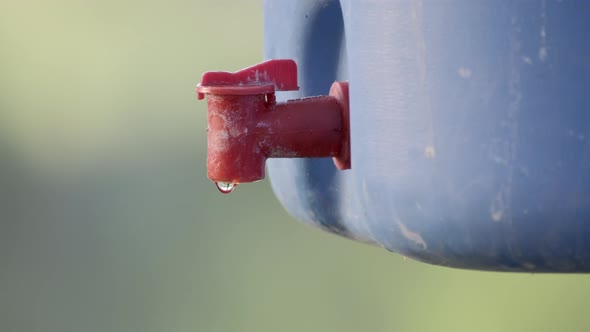 Water saving concept, Hand close water valve to stop water drop from faucet