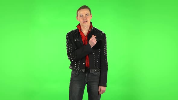 Guy Showing Heart with Fingers Then Blowing Kiss. Green Screen