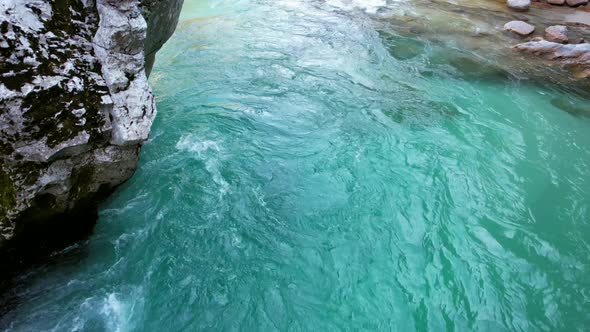 The Soča River in Slovenia, part of the Triglav National Park, has an emerald green color, and is on