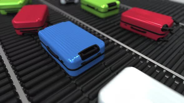 Different Suitcases Move on Roller Conveyor
