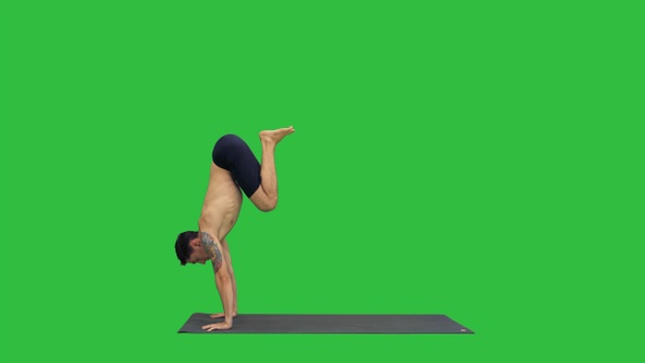 Young Man Doing Yoga on A Green Screen, Chroma Key