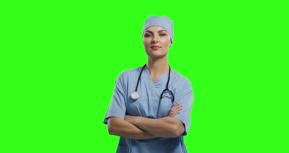 Caucasian female doctor on green screen background