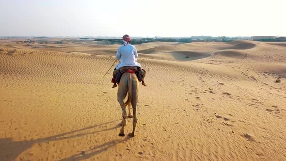 Aerial Survey Drone Flies Over Bedouin, Which Goes Through the Desert