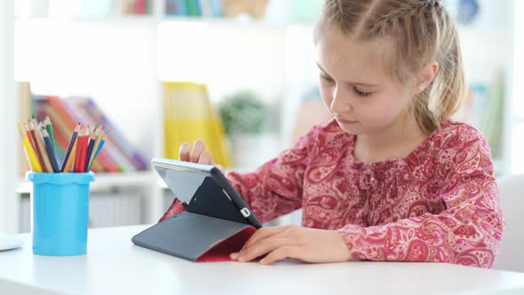 Little Girl Using Digital Tablet for Learning