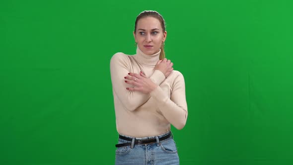 Nervous Young Woman Itching at Chromakey Background