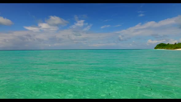 Aerial top down seascape of exotic sea view beach journey by turquoise lagoon with clean sandy backg