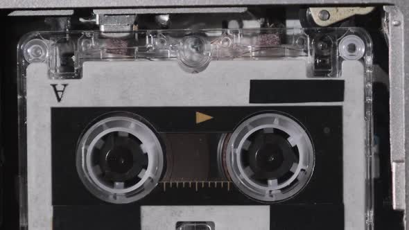 The Microcassette Spins in a Portable Handheld Recorder Tape Retro Player